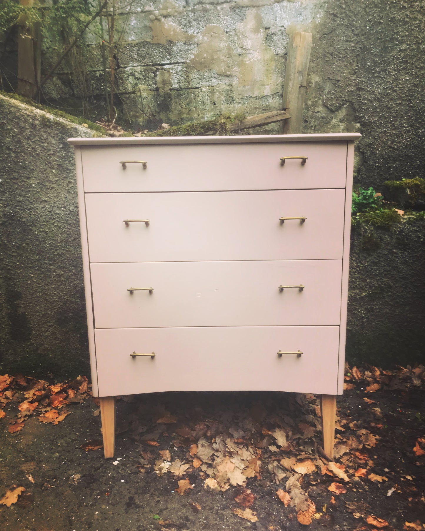 Mid century chest of drawers painted in soft plaster with restored beech legs.