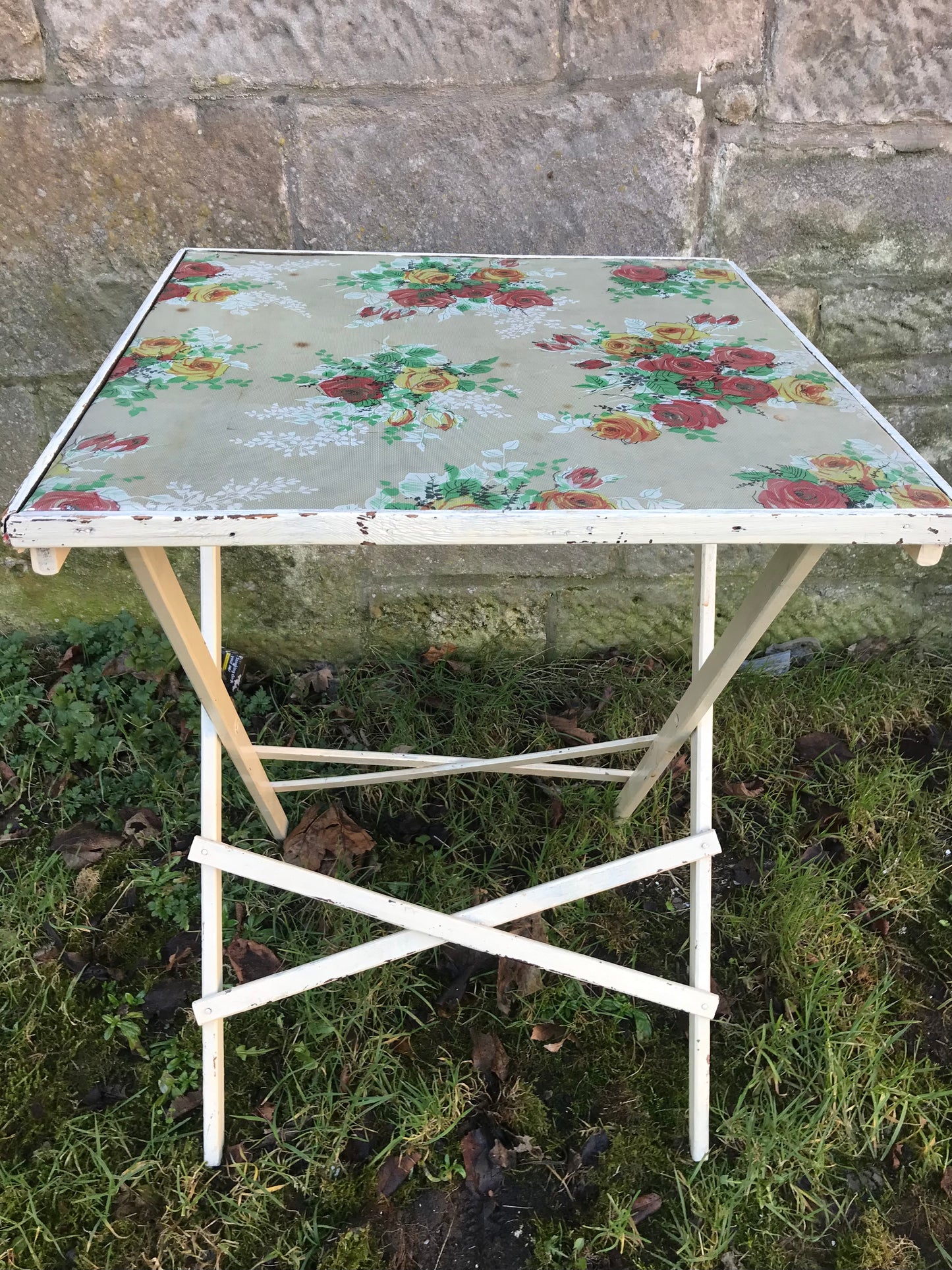 Folding 1950's table with floral padded vinyl fabric top