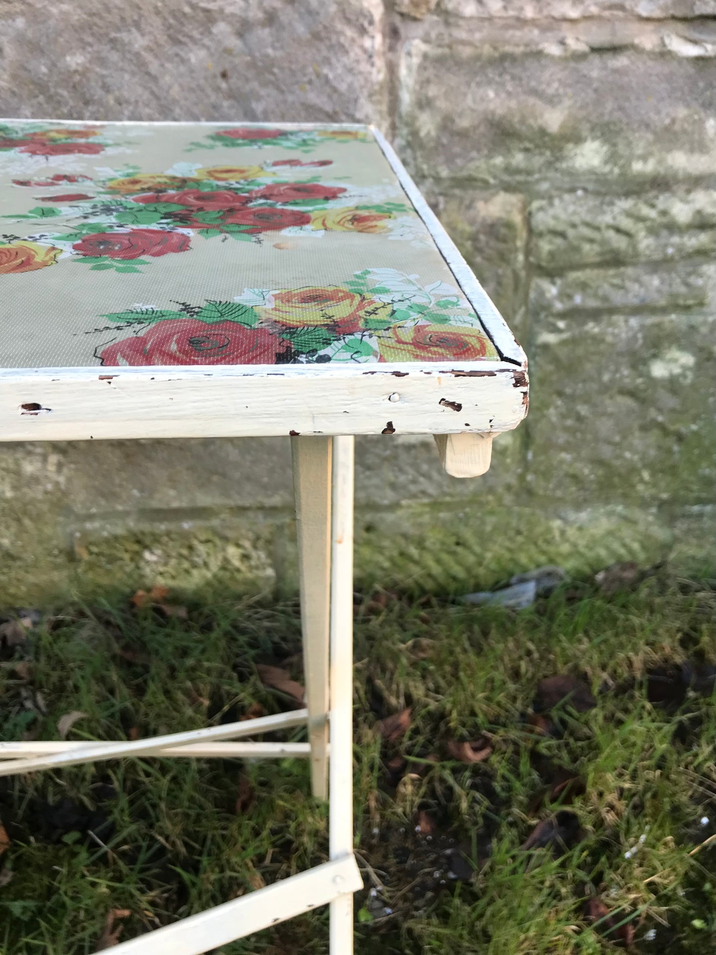 Folding 1950's table with floral padded vinyl fabric top