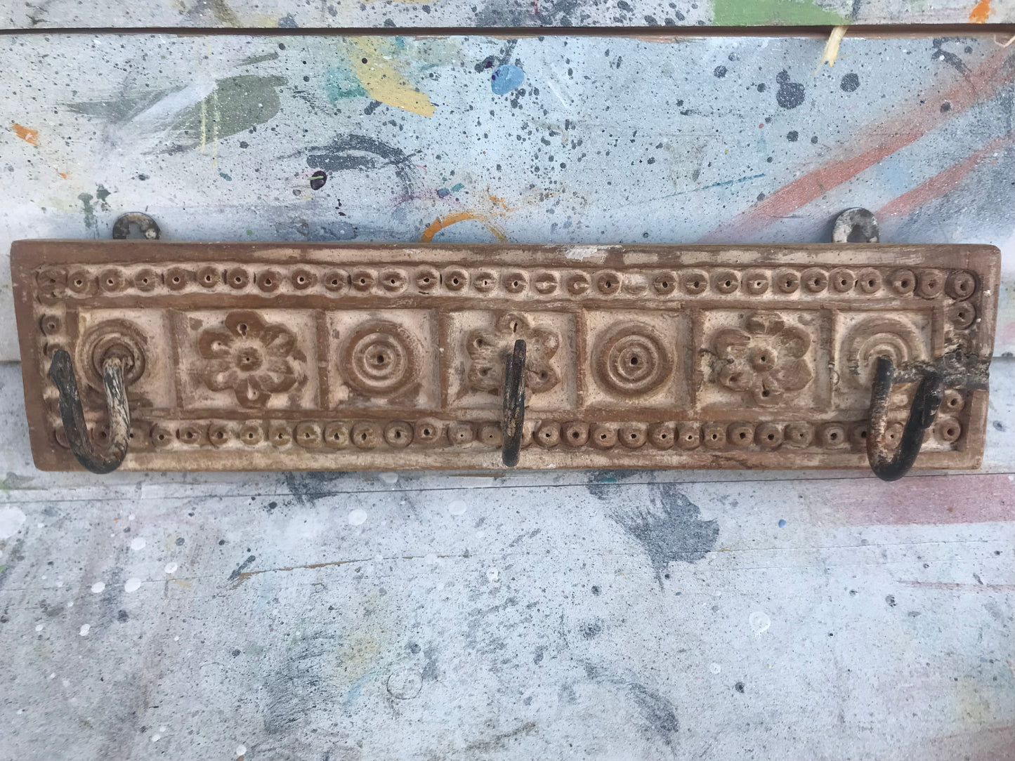 Hand carved Indian coat hooks.