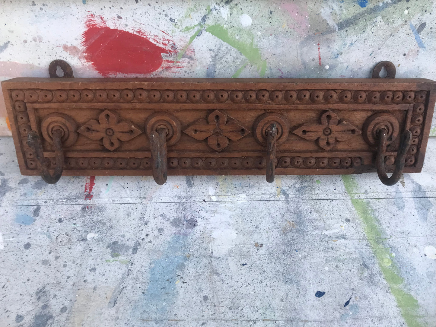 Hand carved Indian coat hooks.