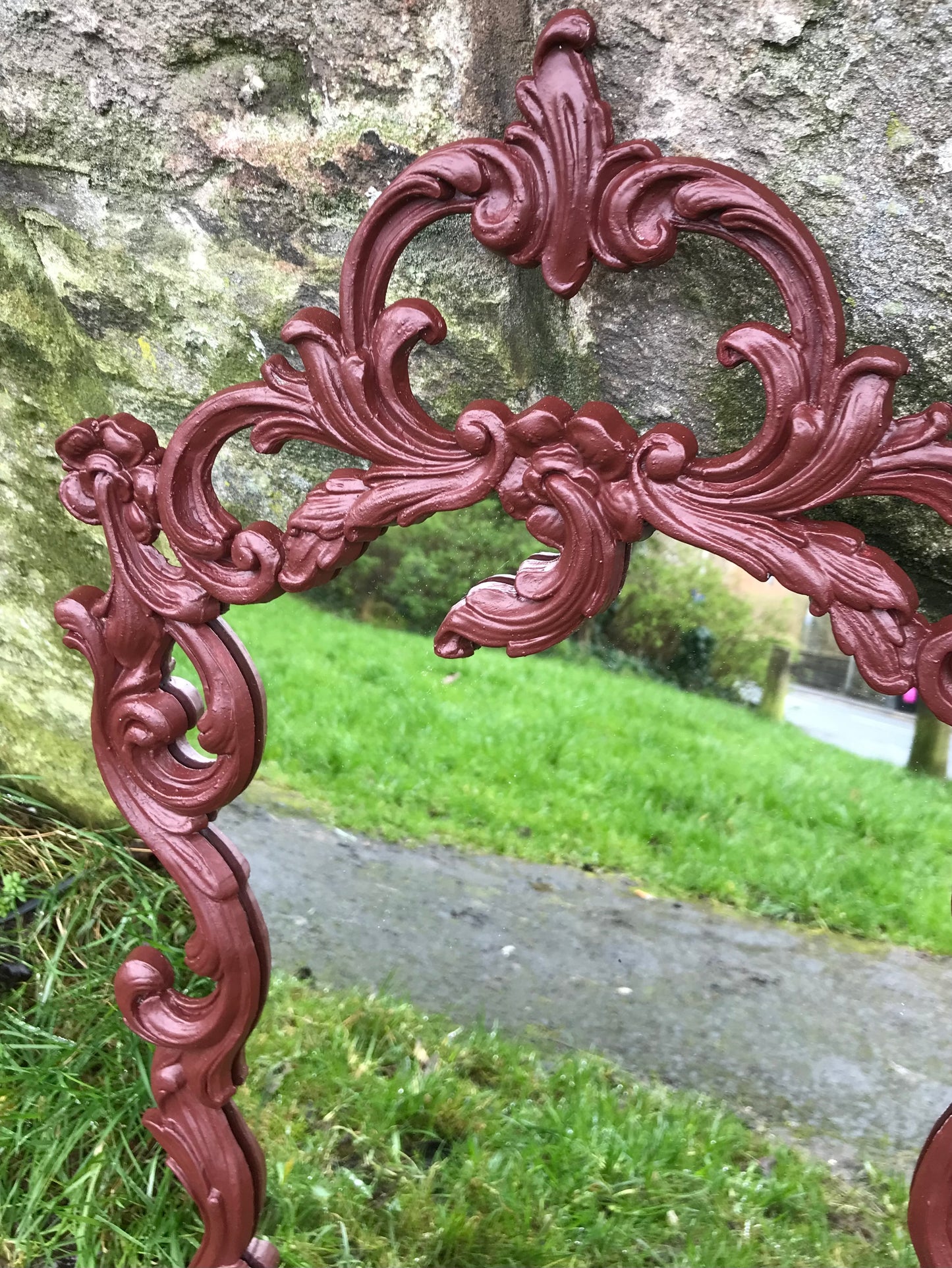 Ornate reproduction vintage plastic moulded mirror painted in a deep dark burgundy