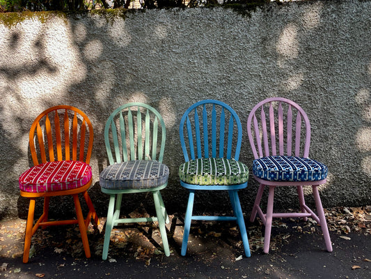 Mismatched vintage dining chairs painted in Guild Lane paint with seat pads in your choice of fabric. Please contact me for a delivery quote