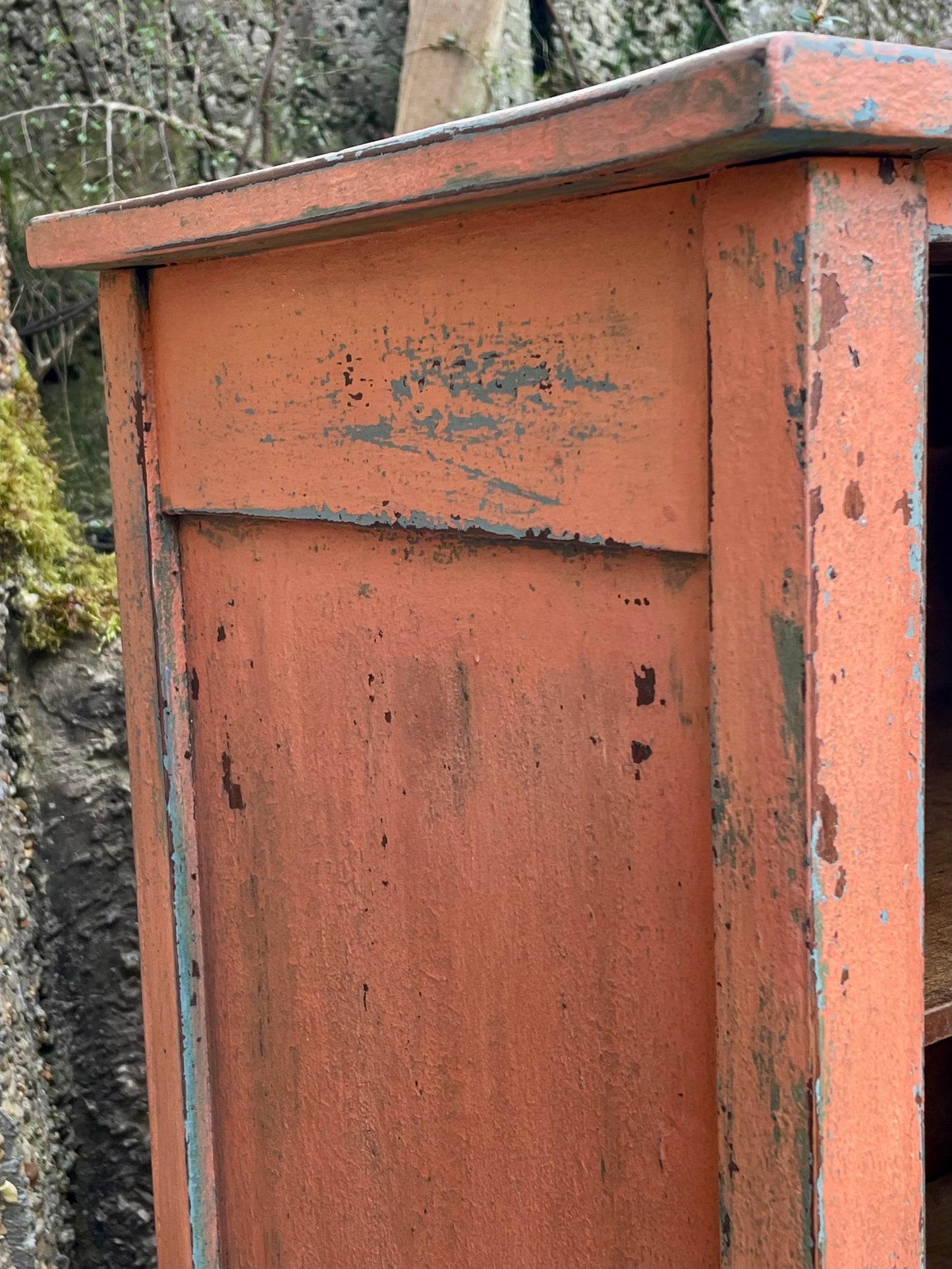 Vintage glass fronted cabinet painted in layers of traditional milk paint