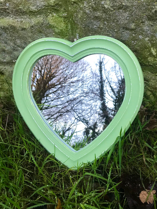 Small heart shaped wall mirror updated in pistachio green