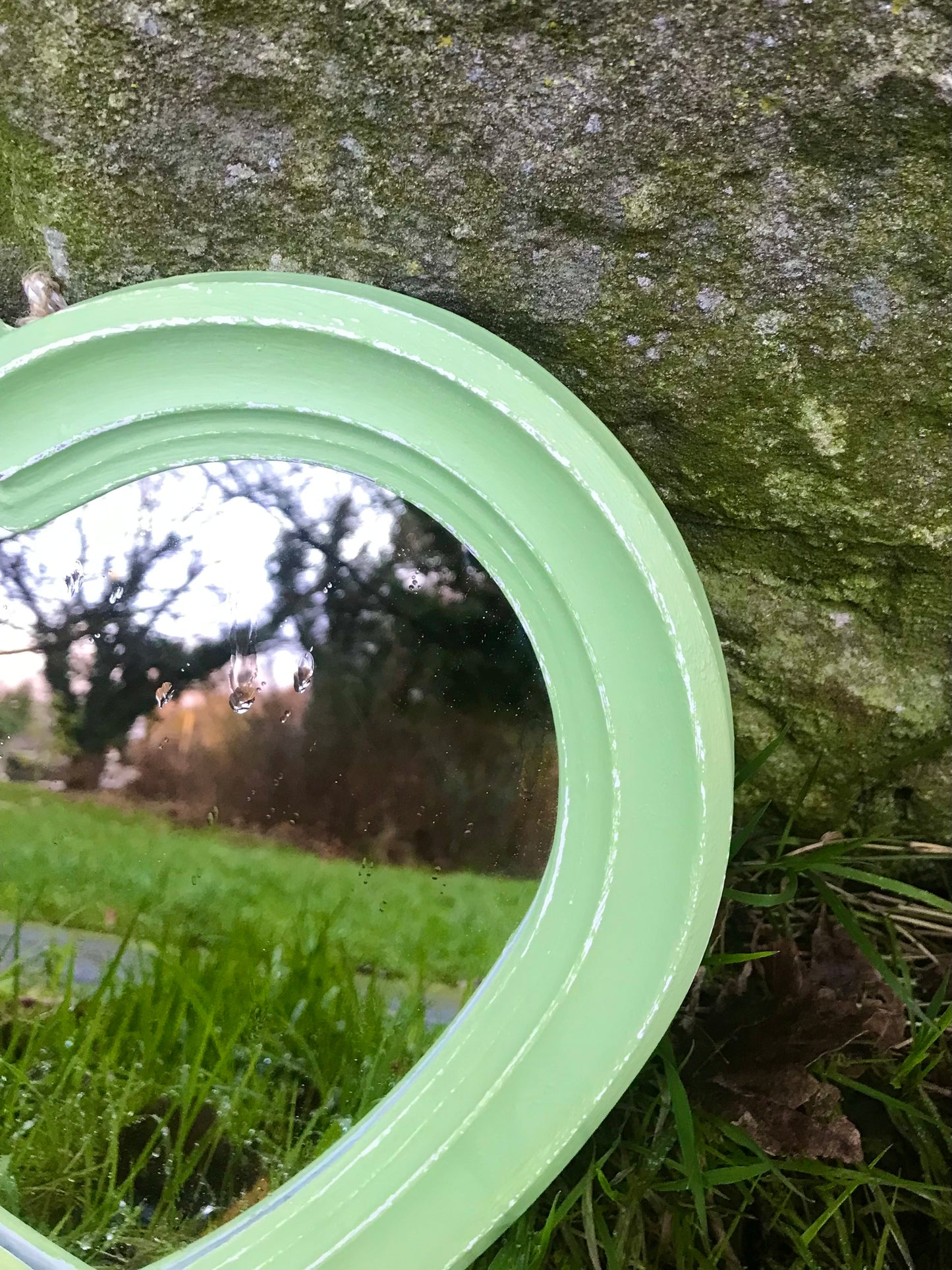 Small heart shaped wall mirror updated in pistachio green