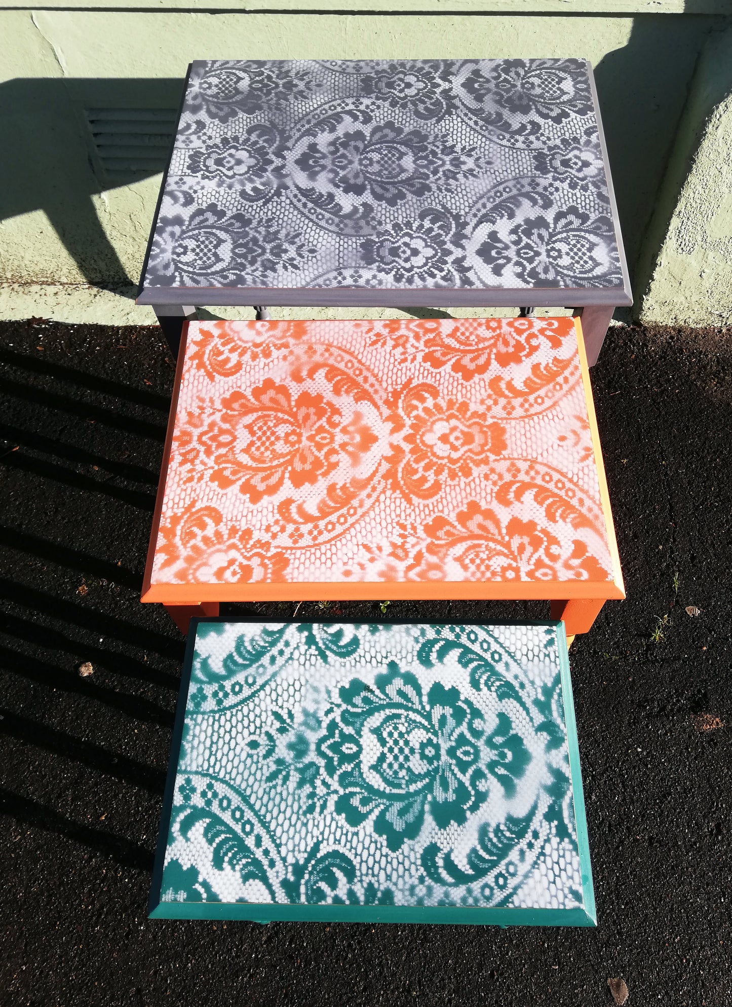 nest of tables with lace design