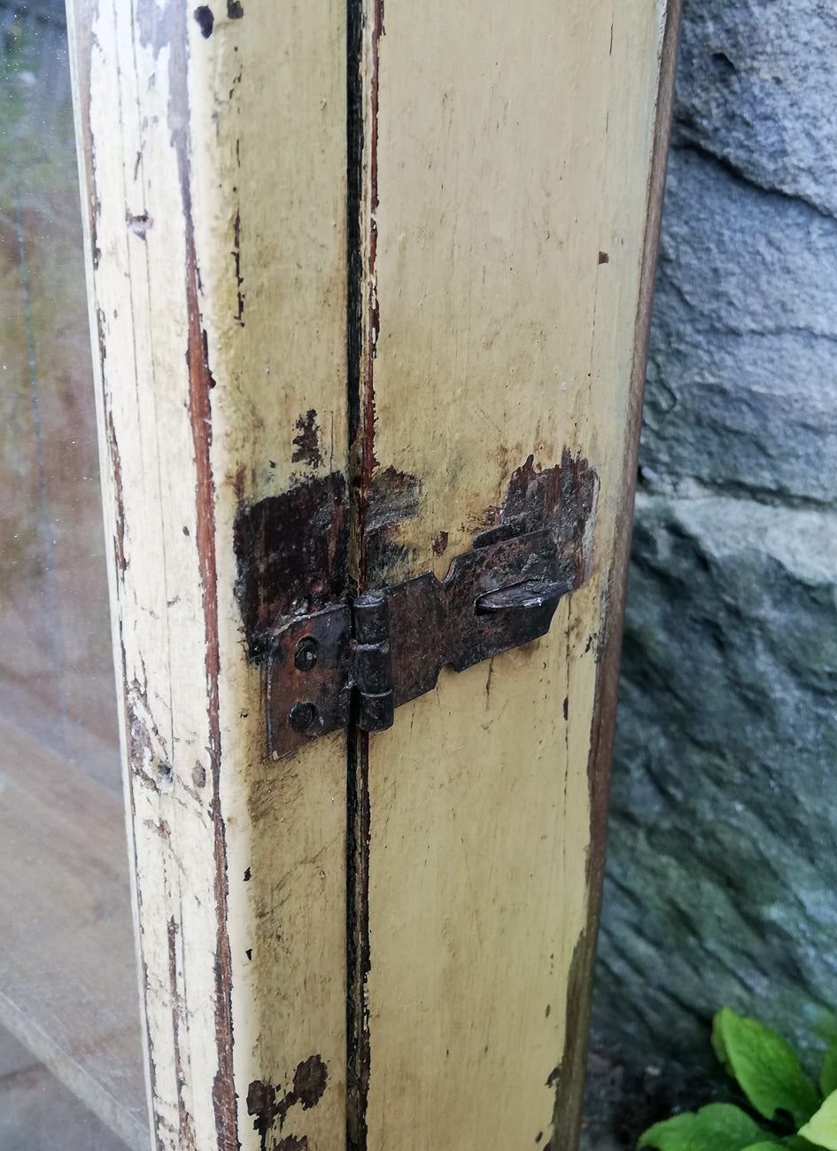Beautiful antique teak painted glass fronted wall cabinet with original golden yellow chippy paint