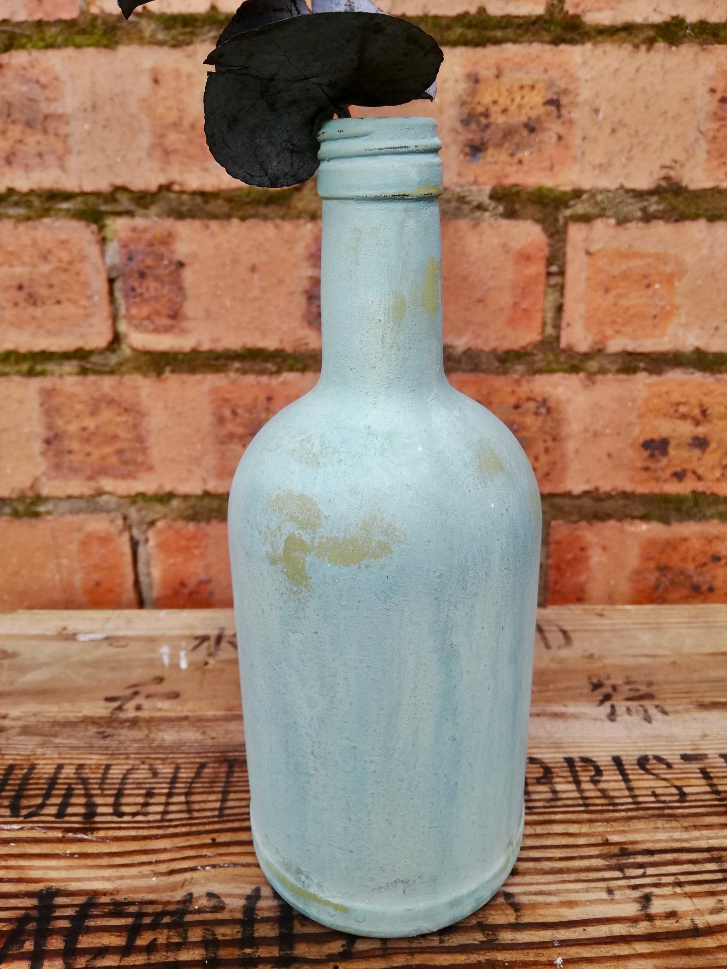 Bud vase painted in layers of milk paint.