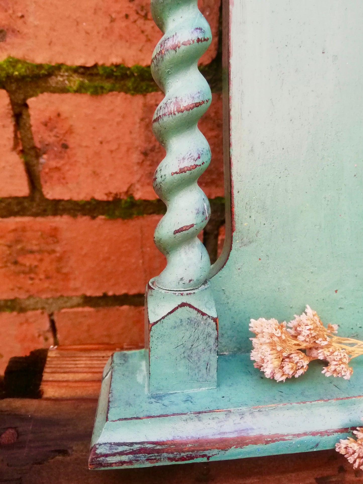 Super cute little wall mirror with hooks.