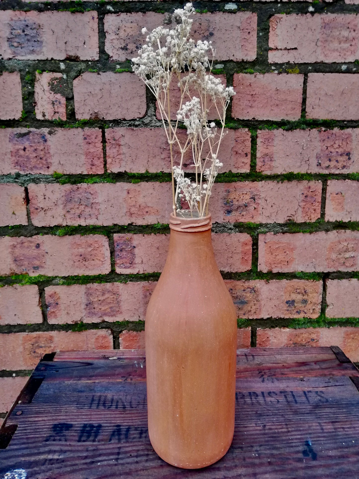 Bottle bud vase painted in layers of milk paint.