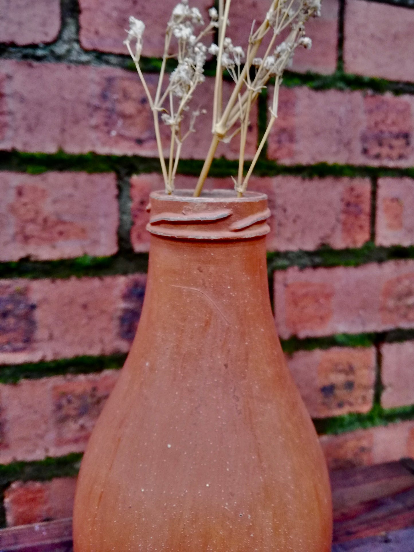 Bottle bud vase painted in layers of milk paint.