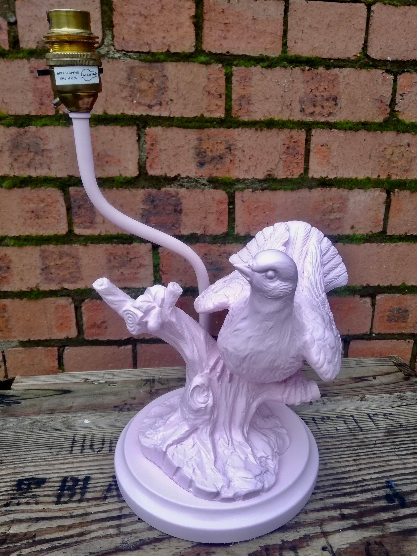 Vintage ceramic bird on a branch lamp base revamped using pink spray paint