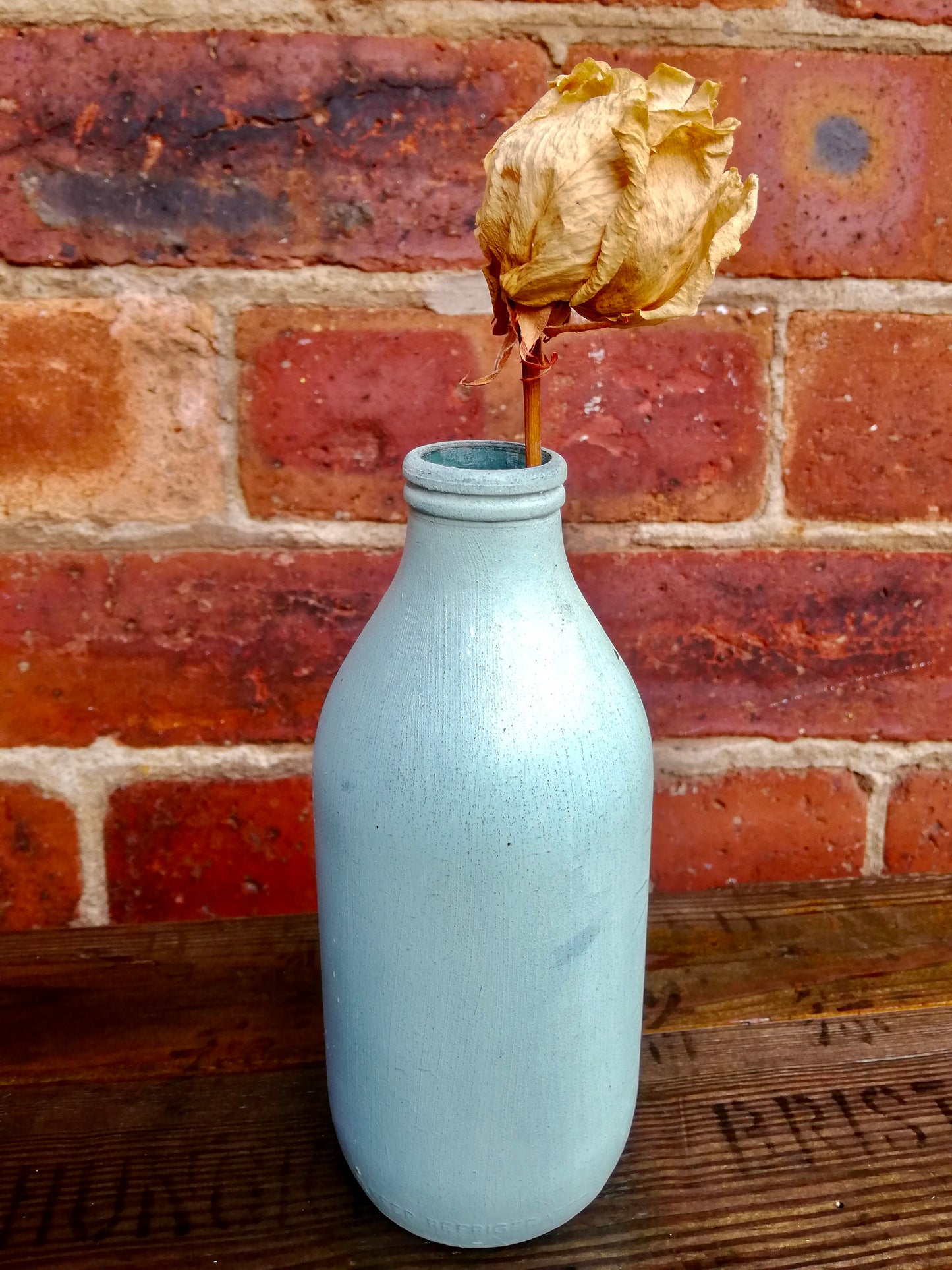 Bottle bud vase painted in layers of milk paint.