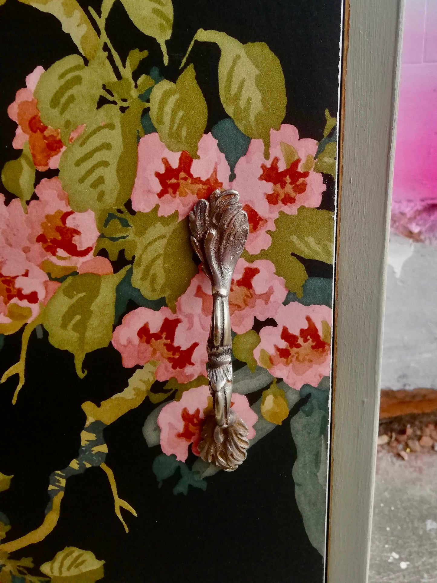 Vintage bedside cabinet in lichen green with tropical decoupaged door.