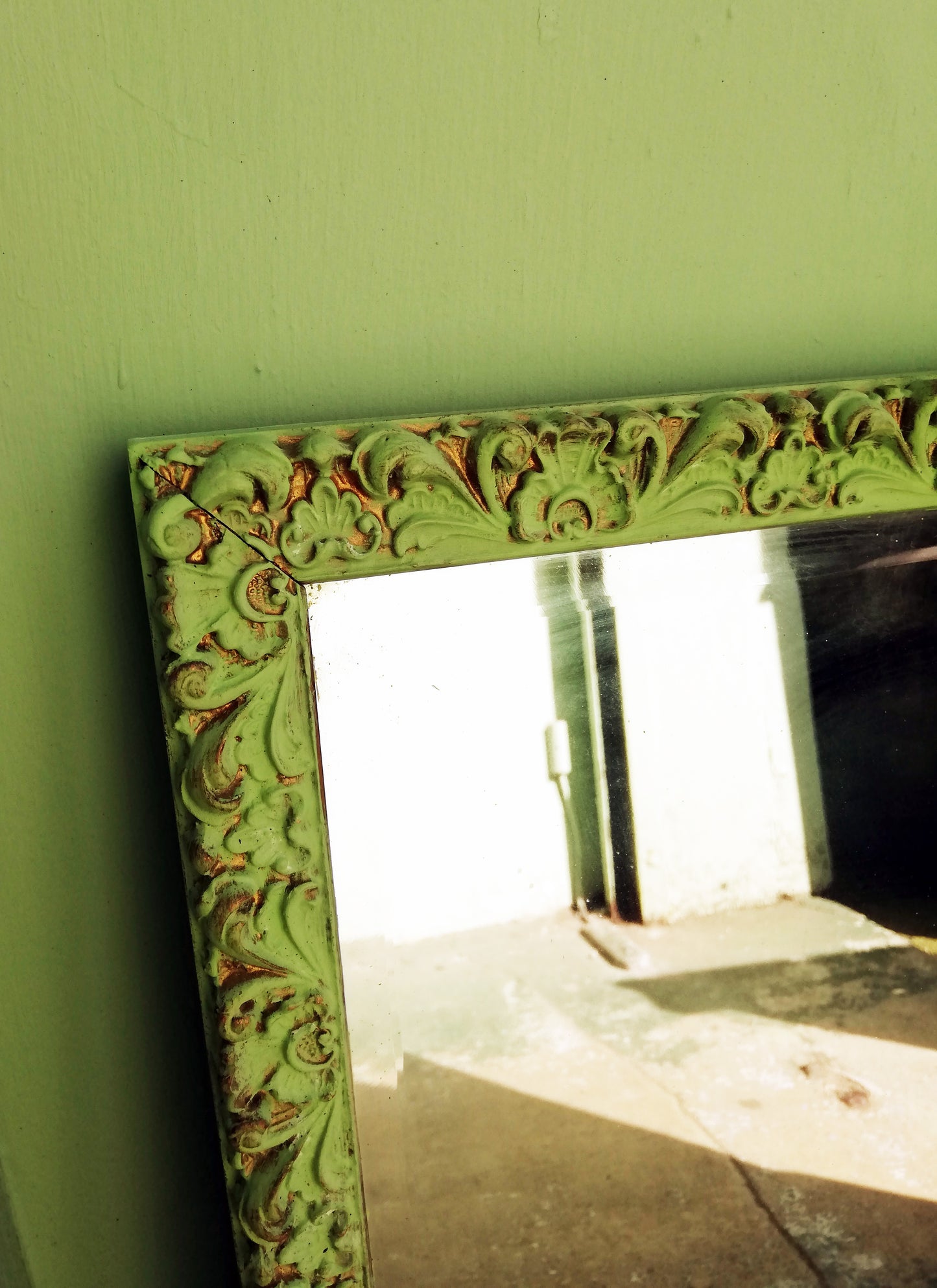 Ornate gold mirror painted in a Pistachio Green antique finish