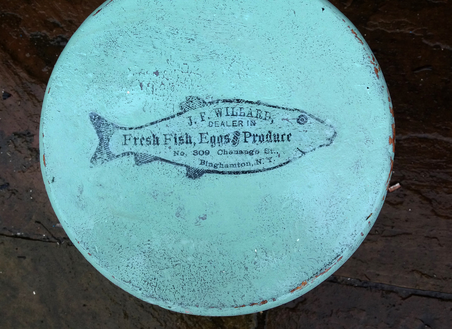 Vintage wooden stool painted in layers of textured paint with fish motif