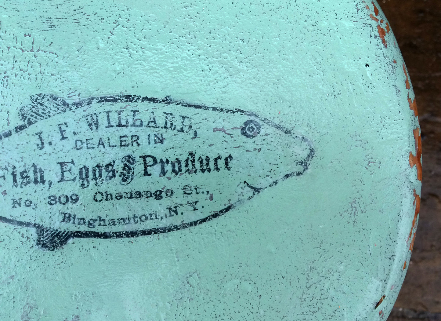 Vintage wooden stool painted in layers of textured paint with fish motif
