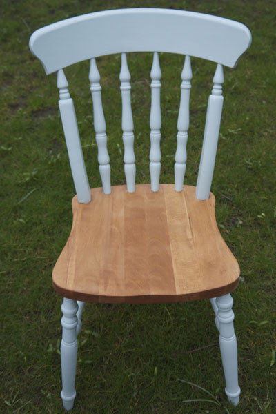 dining chairs in mismatch colours and stripped wooden seats