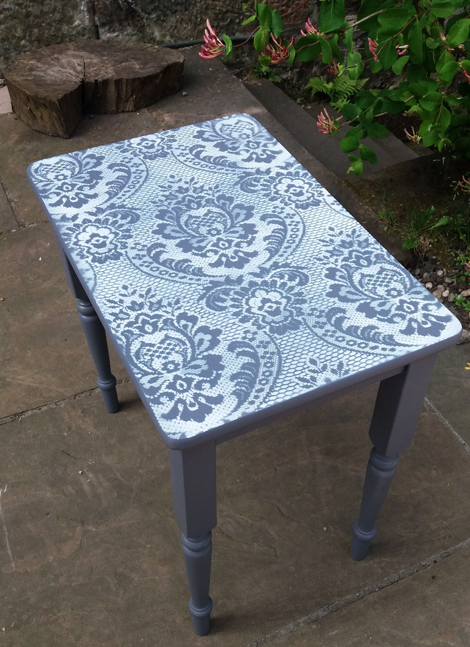 Vintage nest of tables with lace design