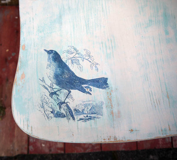 Vintage wheelback chair painted in Miss Mustard Seed Milk Paint in with blue bird toile design