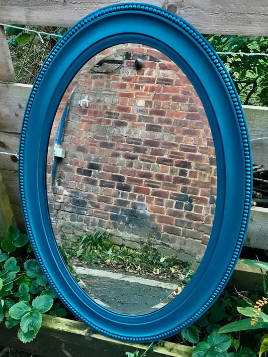 Ornate oval mirror painted in Rail Blue