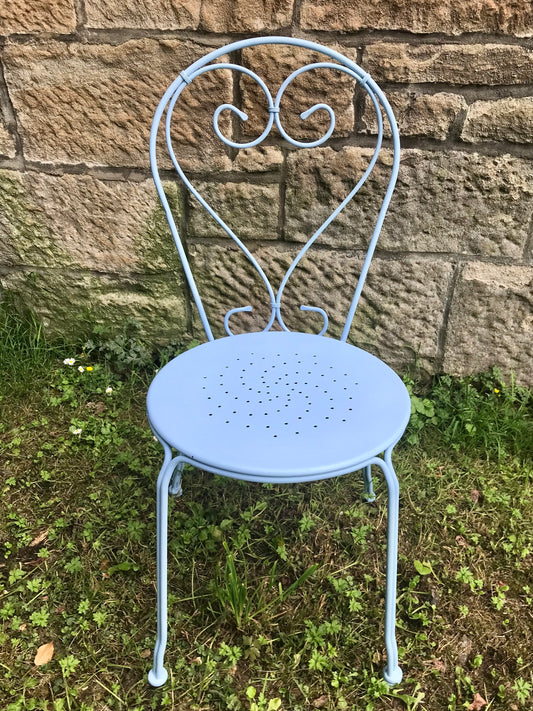 Ornate metal chair painted in pale roundel blue
