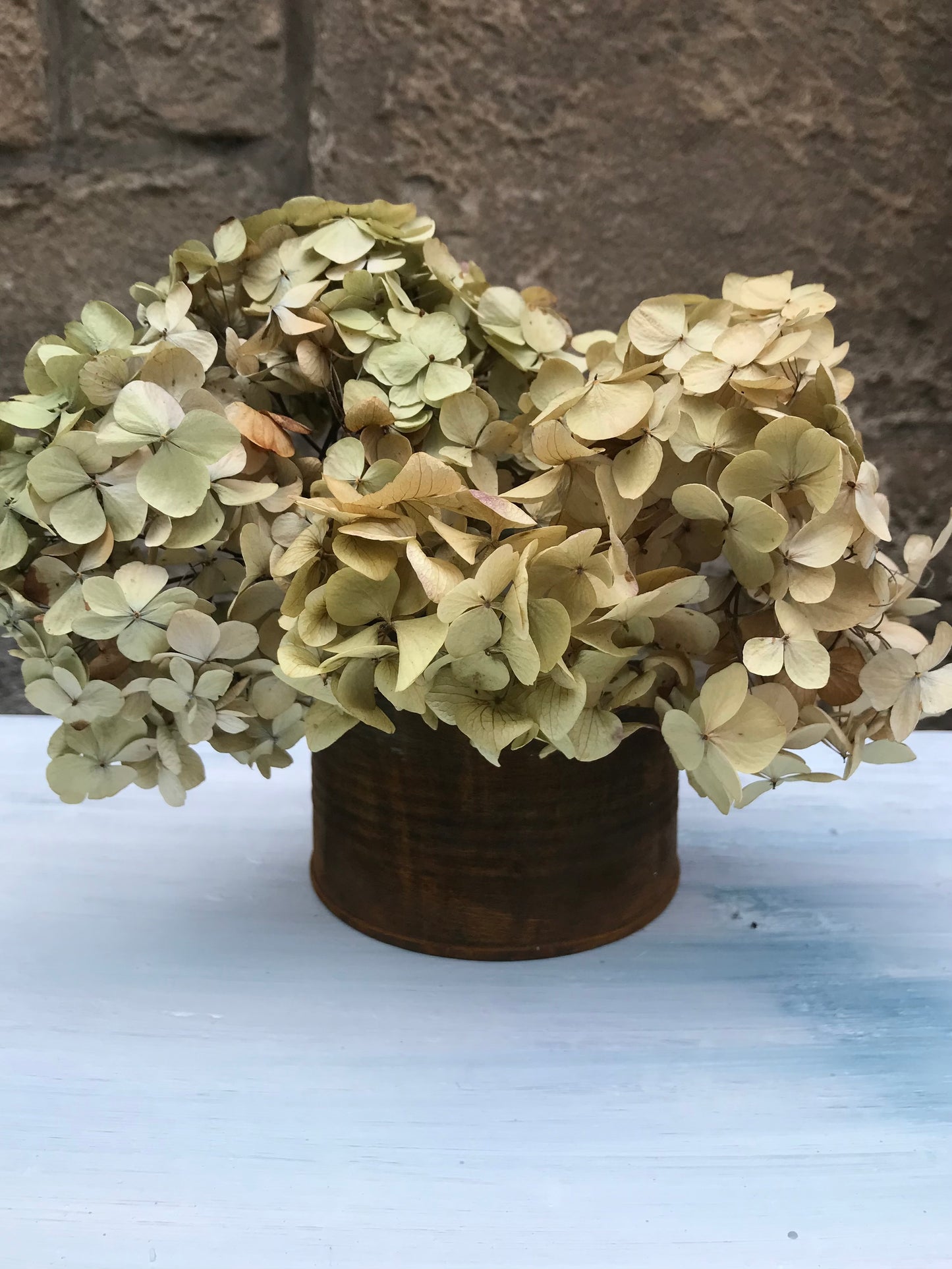 Metal bud vase painted in layers of textured chalk paint in a rust finish comes with dried flower stems. (Copy)