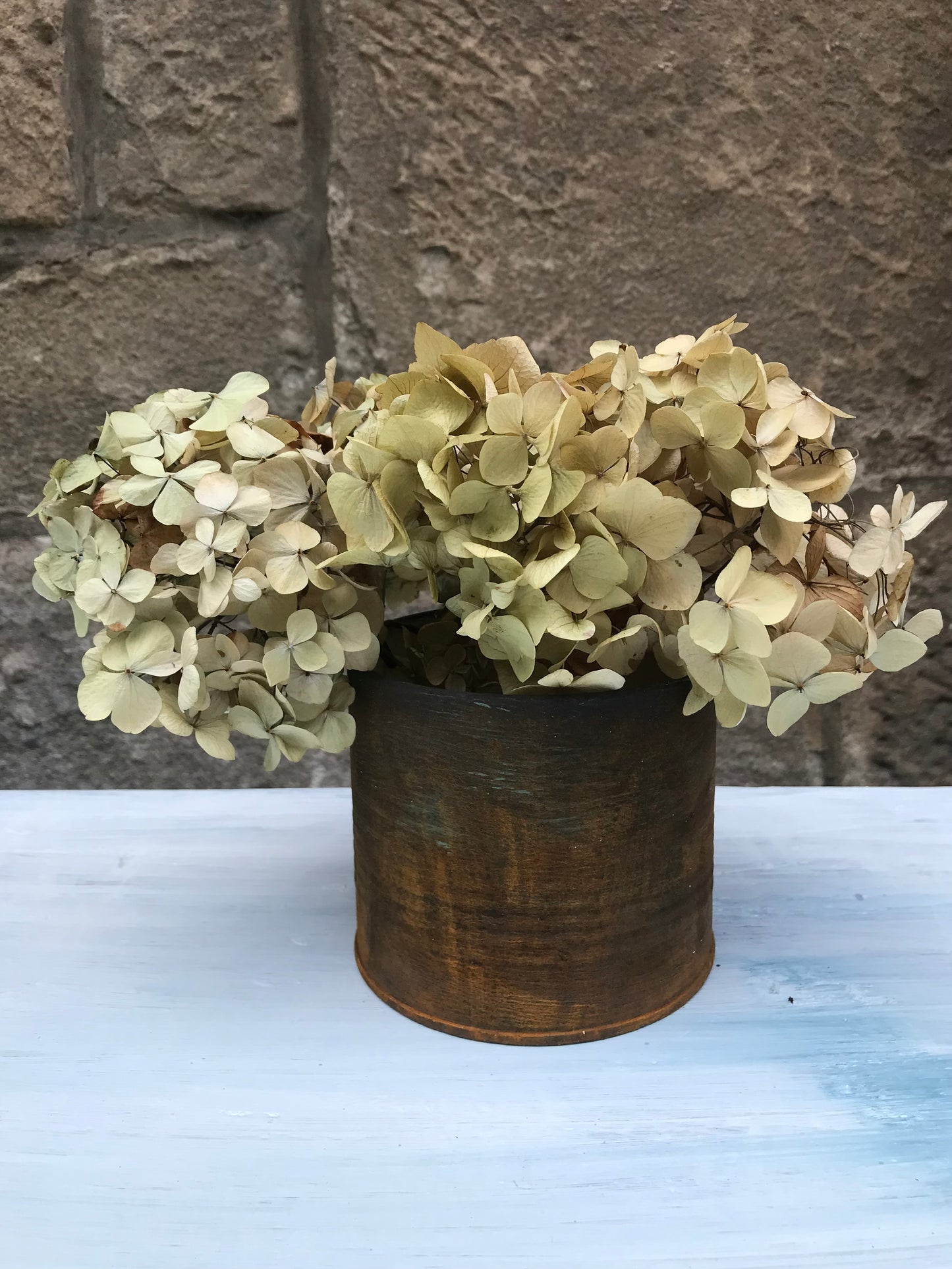 Metal bud vase painted in layers of textured chalk paint in a rust finish comes with dried flower stems. (Copy)