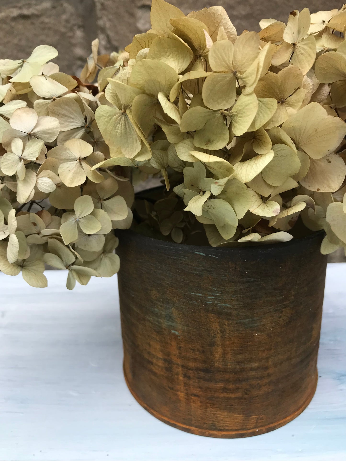 Metal bud vase painted in layers of textured chalk paint in a rust finish comes with dried flower stems. (Copy)