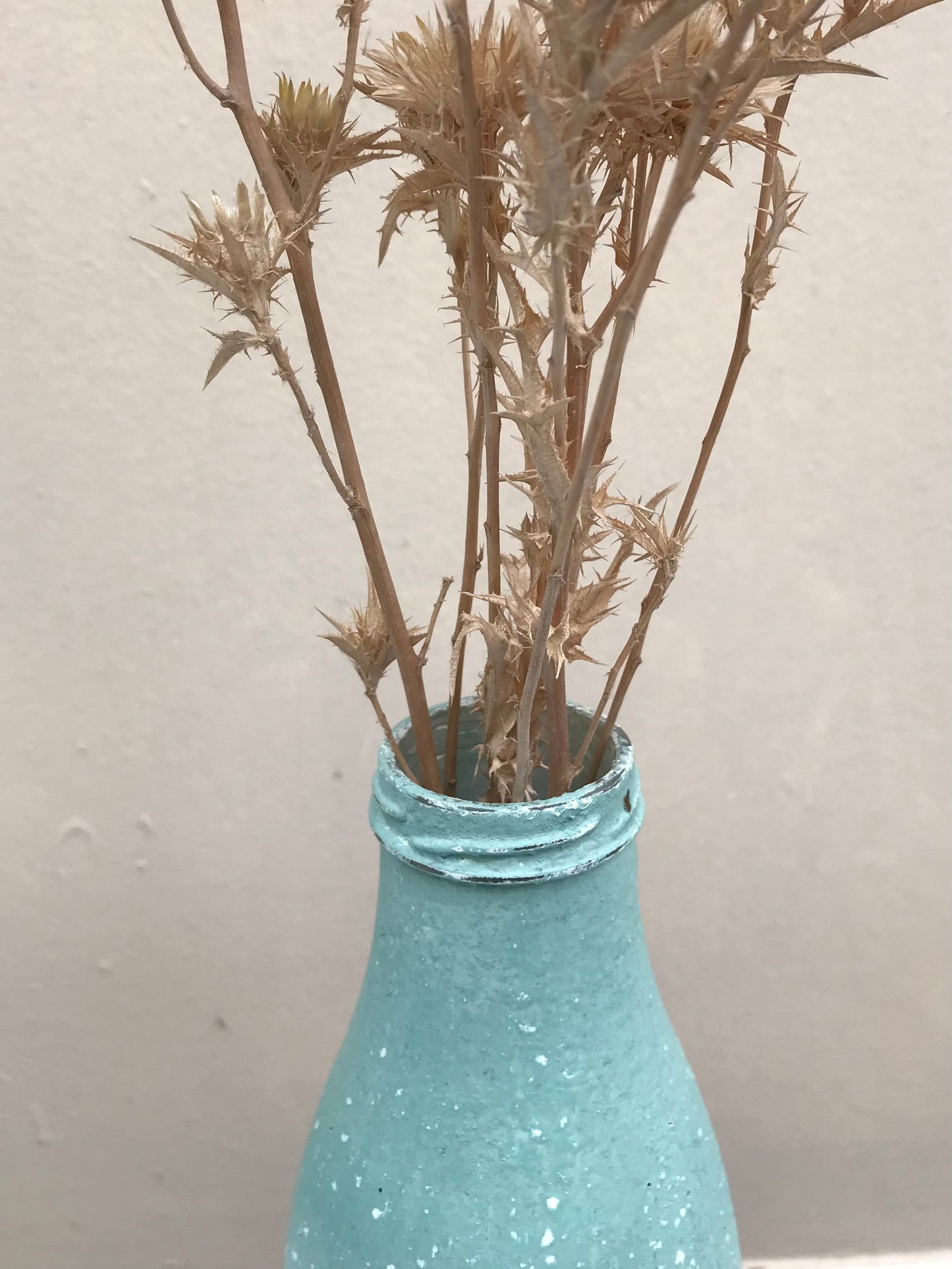 Bottle bud vase painted in layers of textured milk paint