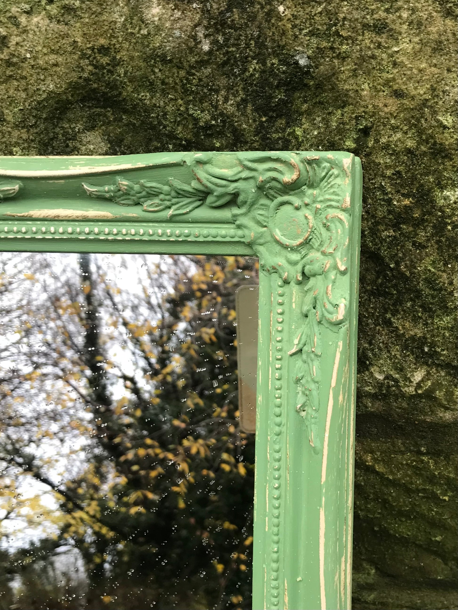 Ornate small wall mirror updated in green