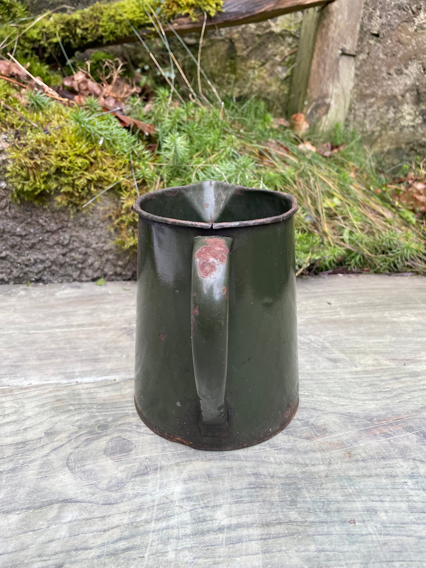 Vintage bottle green enamel jug.