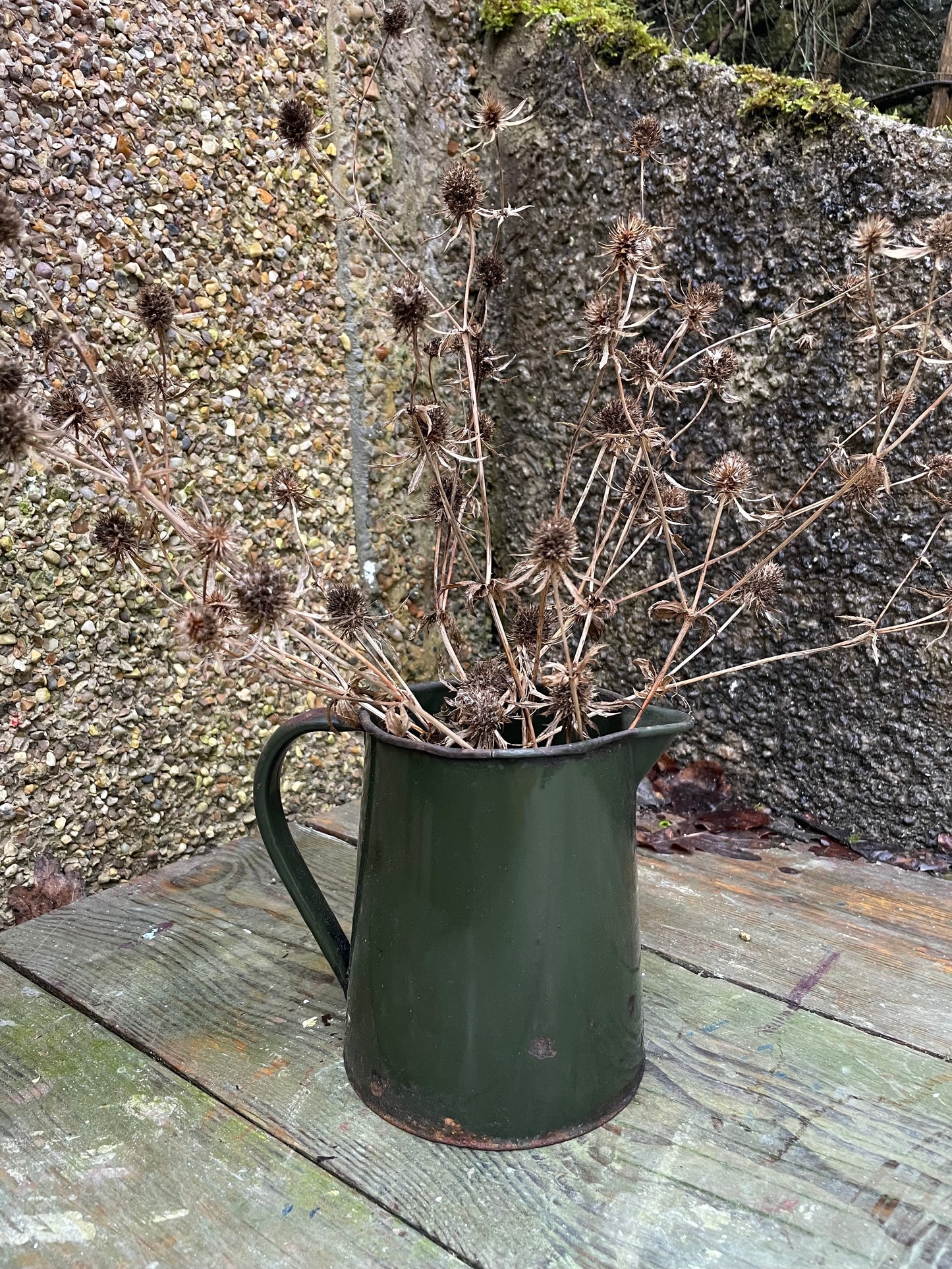 Vintage bottle green enamel jug.