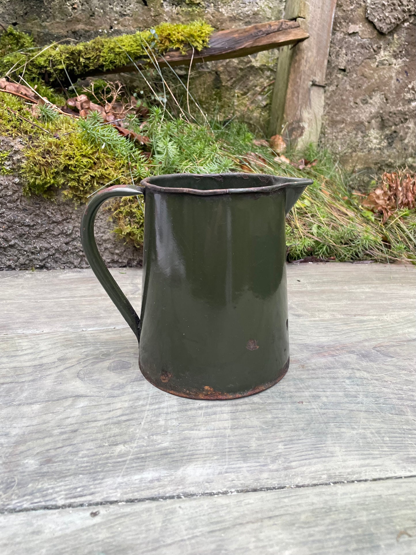 Vintage bottle green enamel jug.