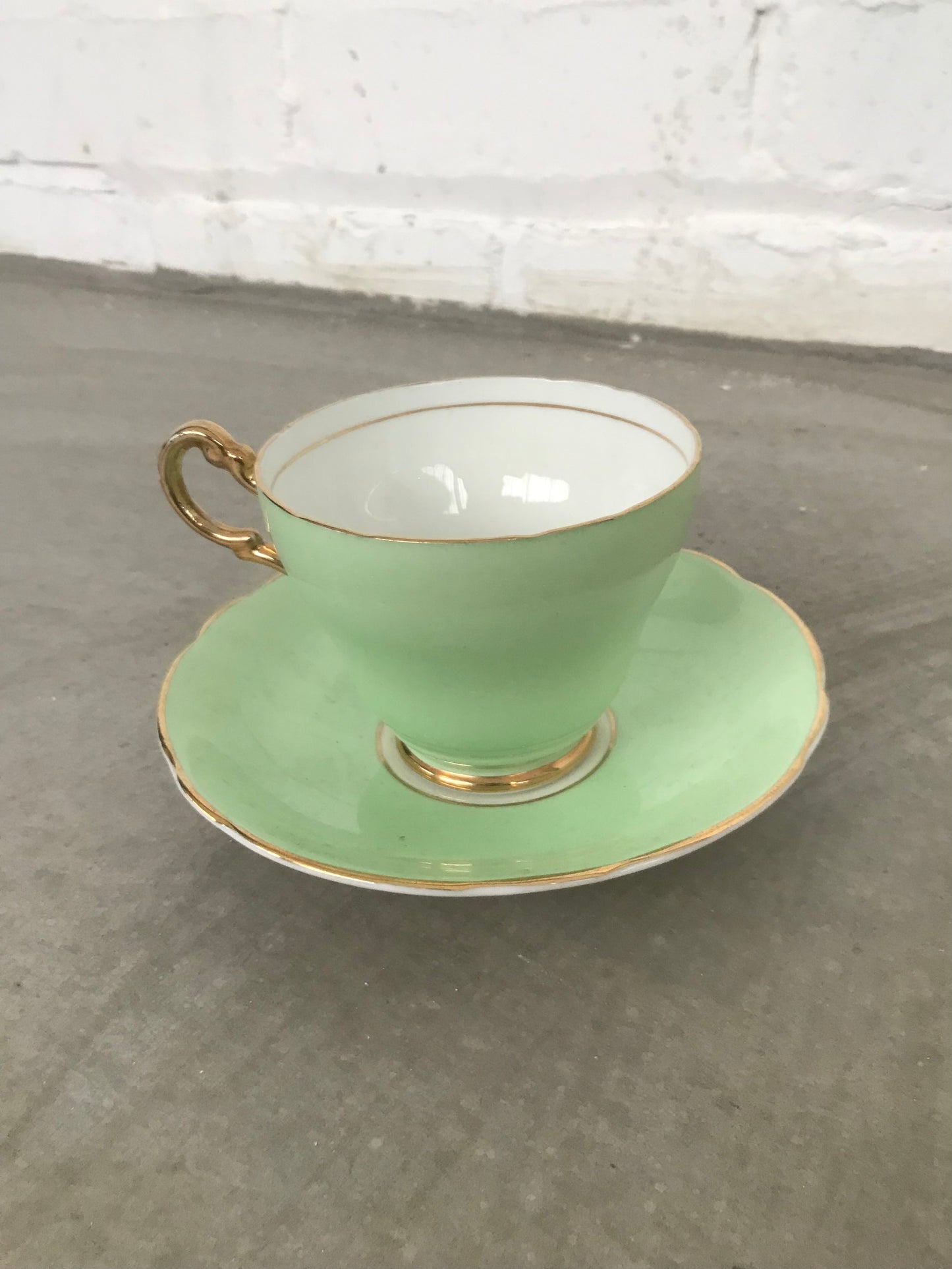 Vintage pastel and white teacups and matching sideplates