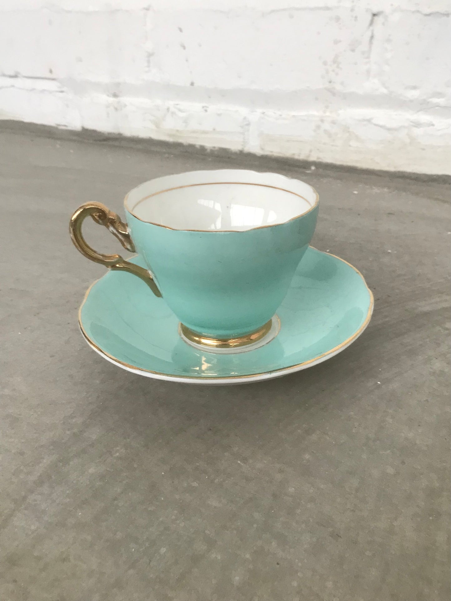 Vintage pastel and white teacups and matching sideplates
