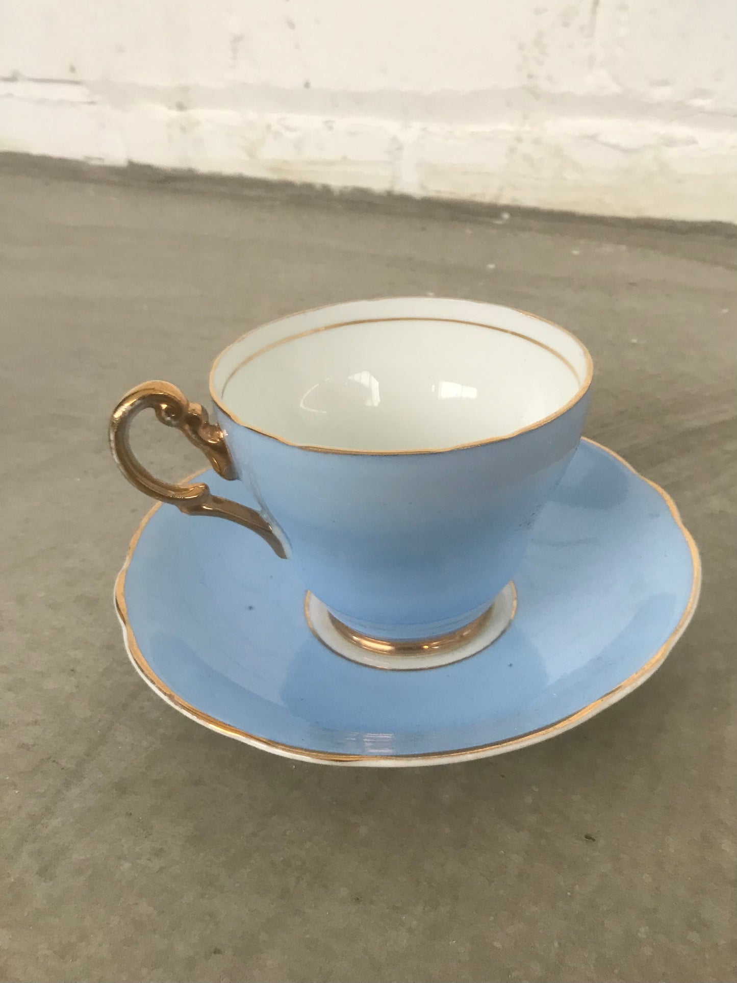 Vintage pastel and white teacups and matching sideplates