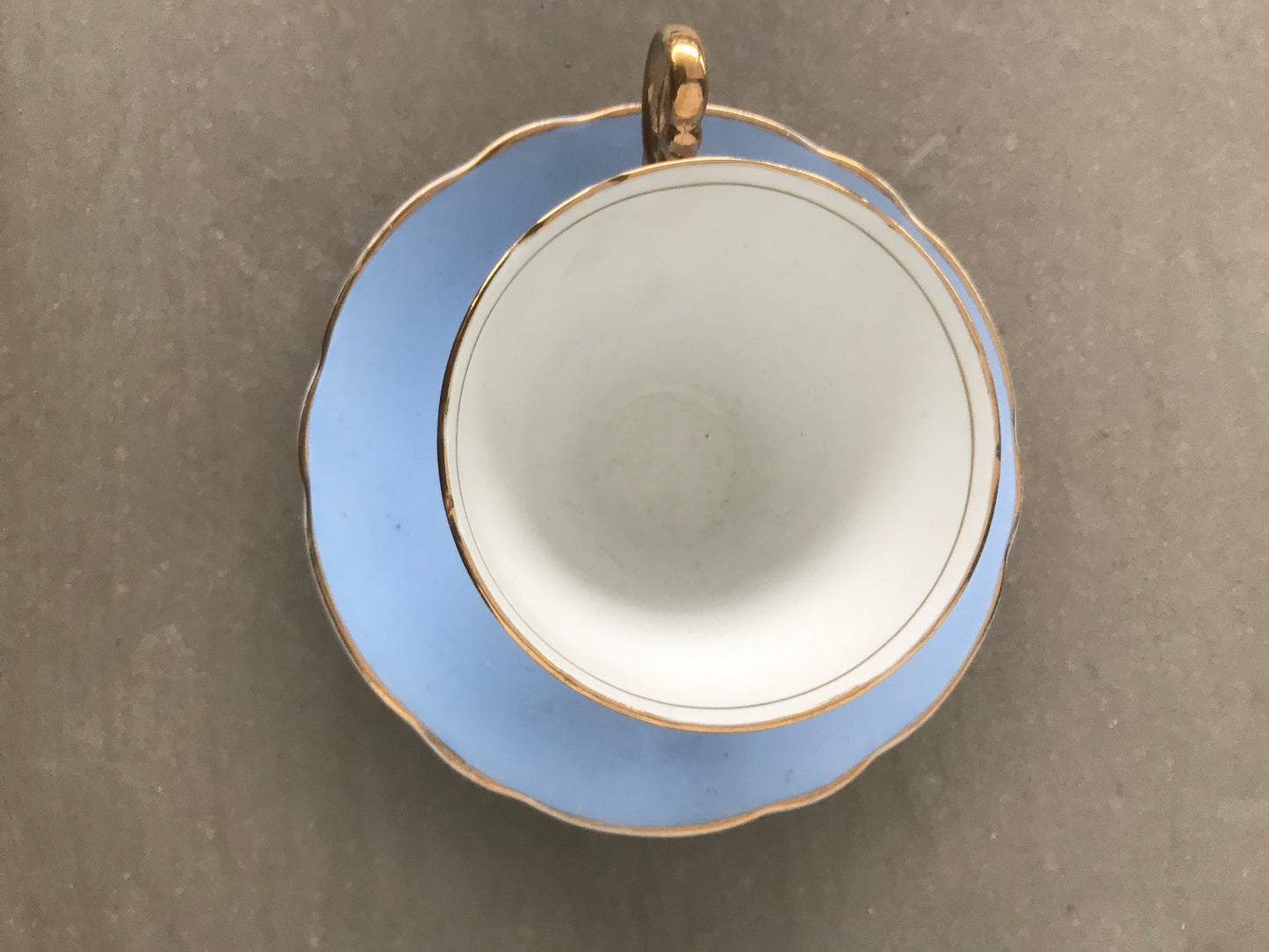 Vintage pastel and white teacups and matching sideplates
