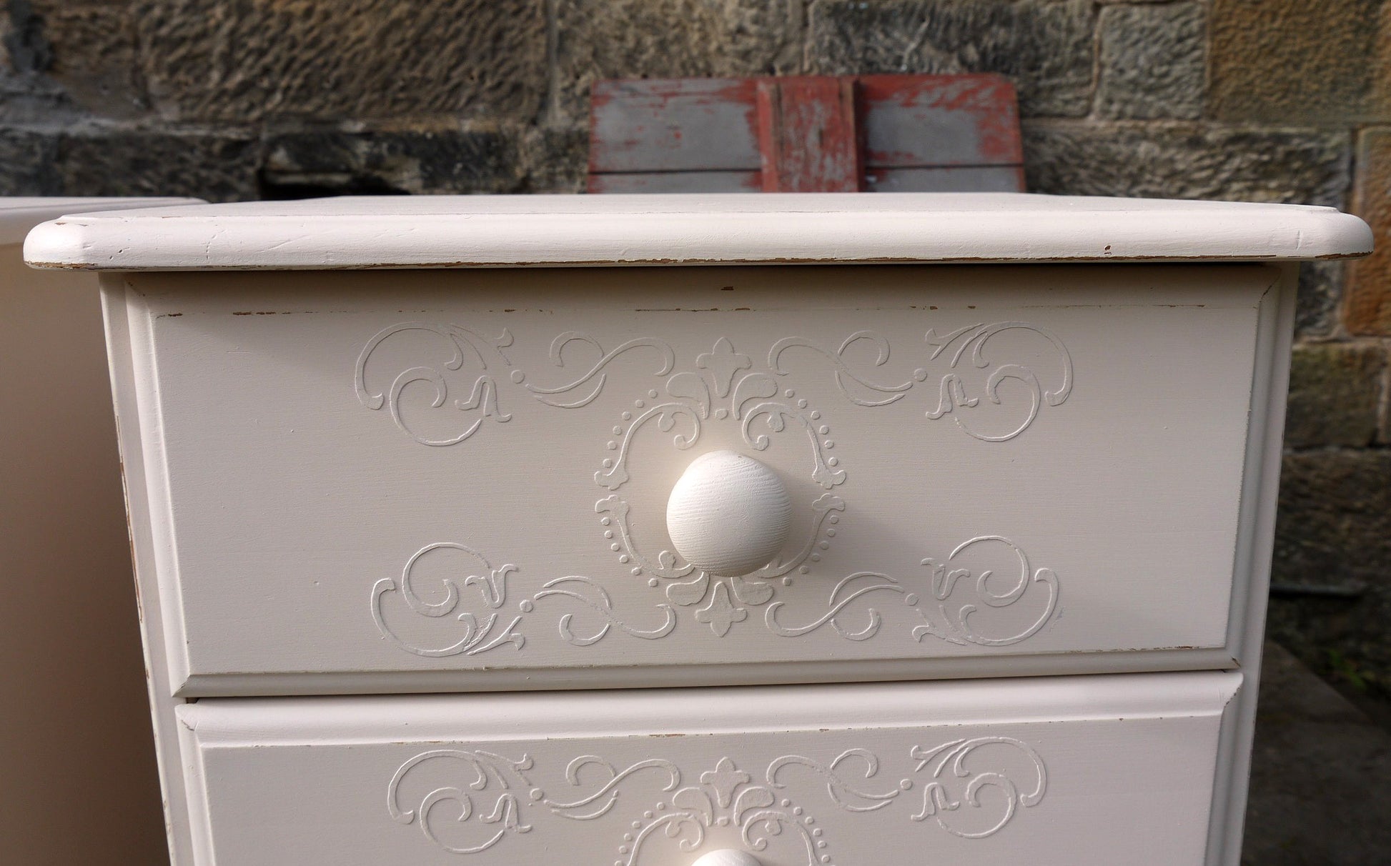 2 bedside tables with embossed drawer stencil