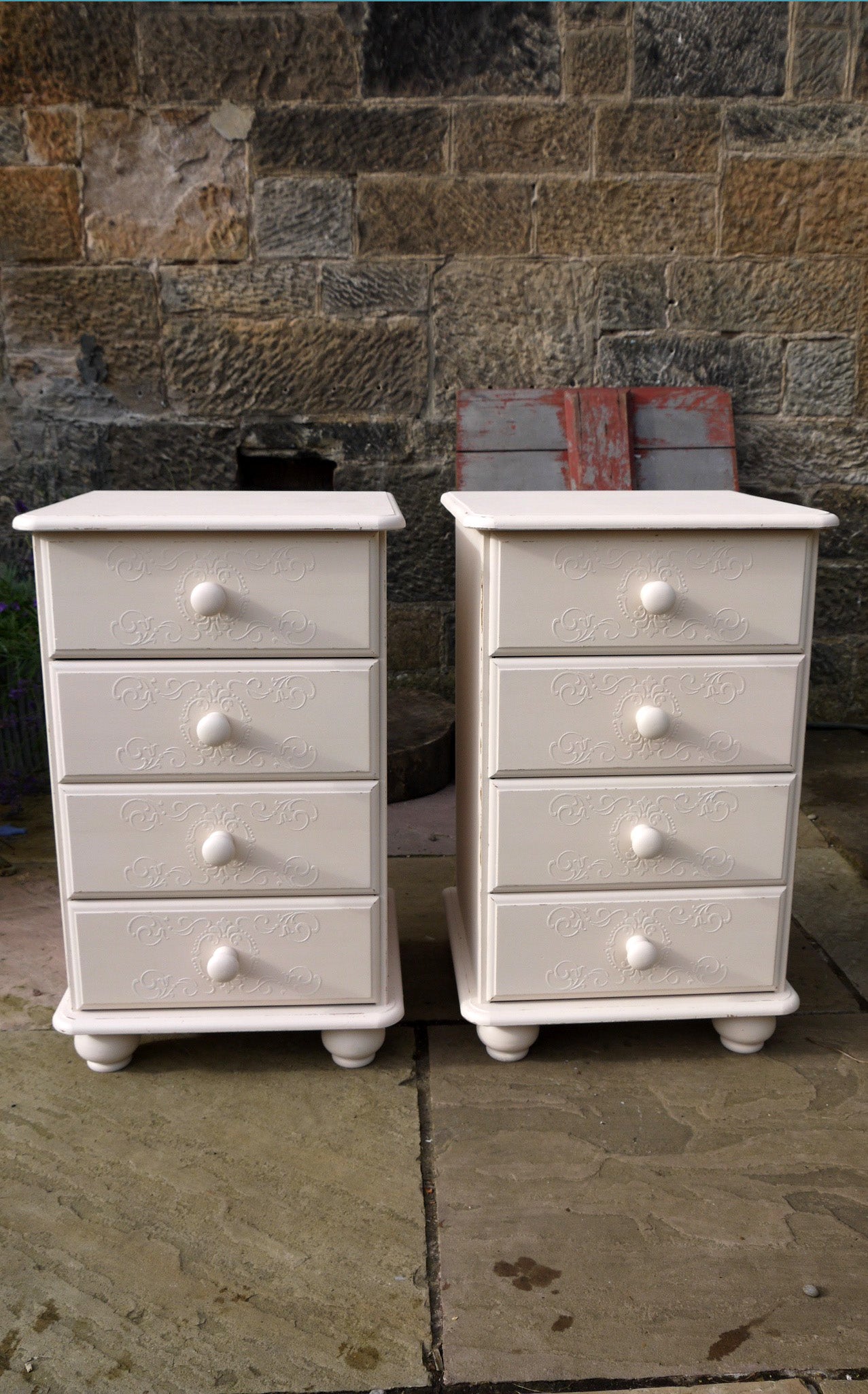 2 bedside tables with embossed drawer stencil