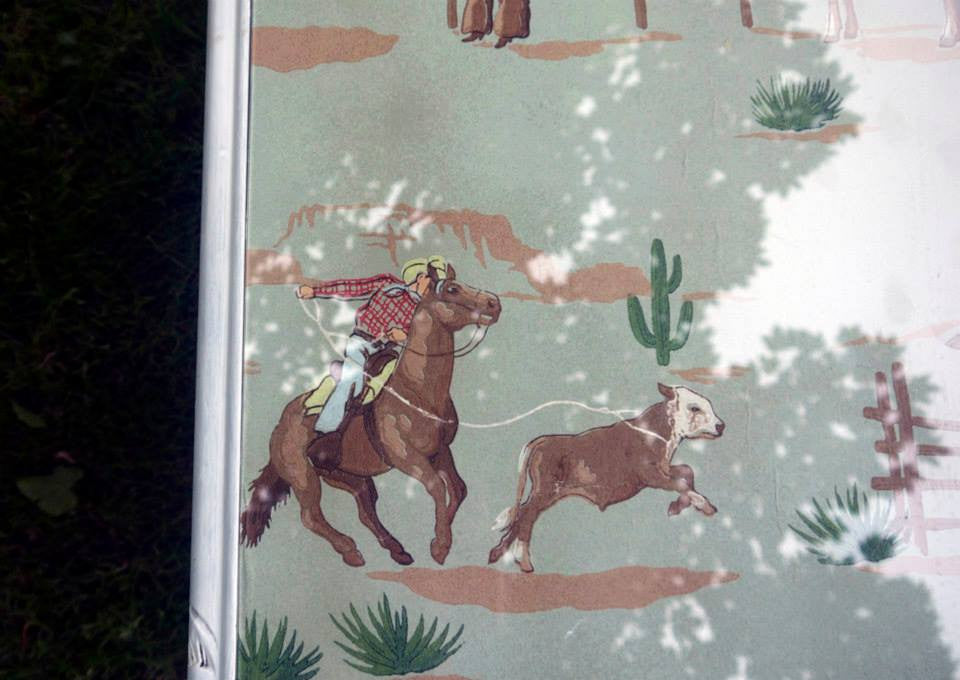 Vintage coffee table with 1940's original hand painted cowboy wallpaper