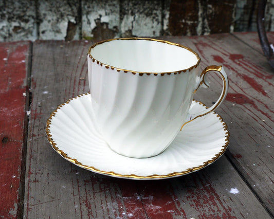 Fluted white and gold vintage teacup and saucer