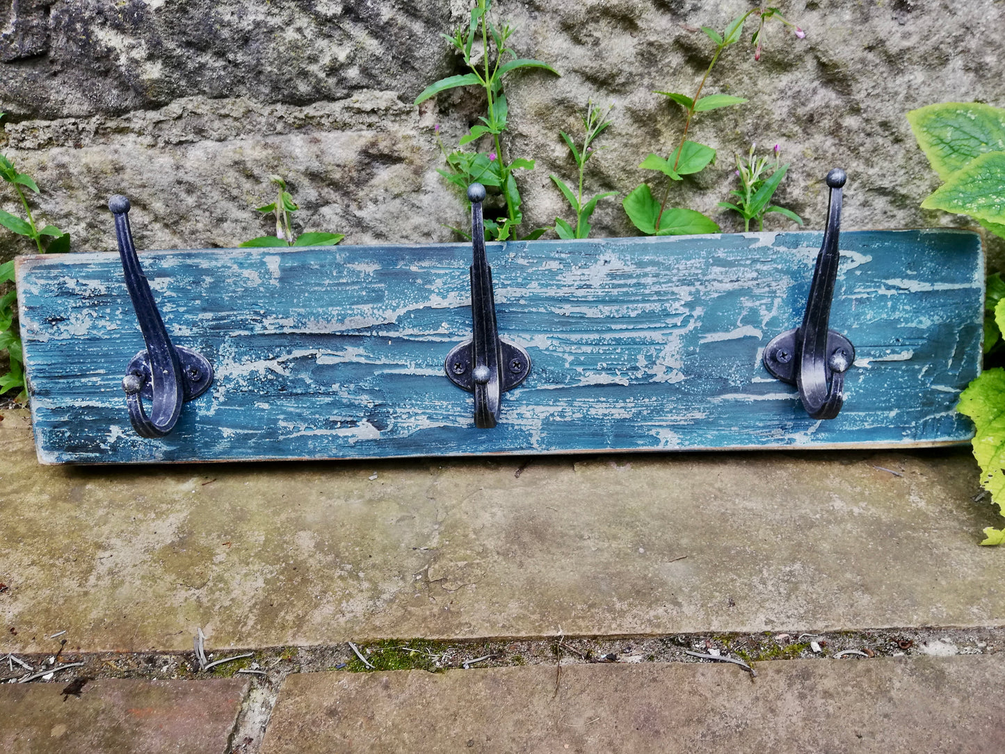 Hand made coat rack with 3 hooks.