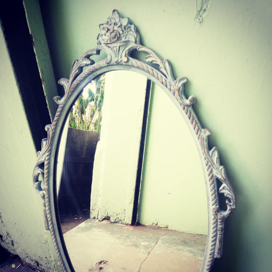 Beautiful painted vintage ornate mirror in soft blue