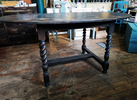 Oval dropleaf barley twist dining table painted in Miss Mustard Seed Milk Paint Typewriter black