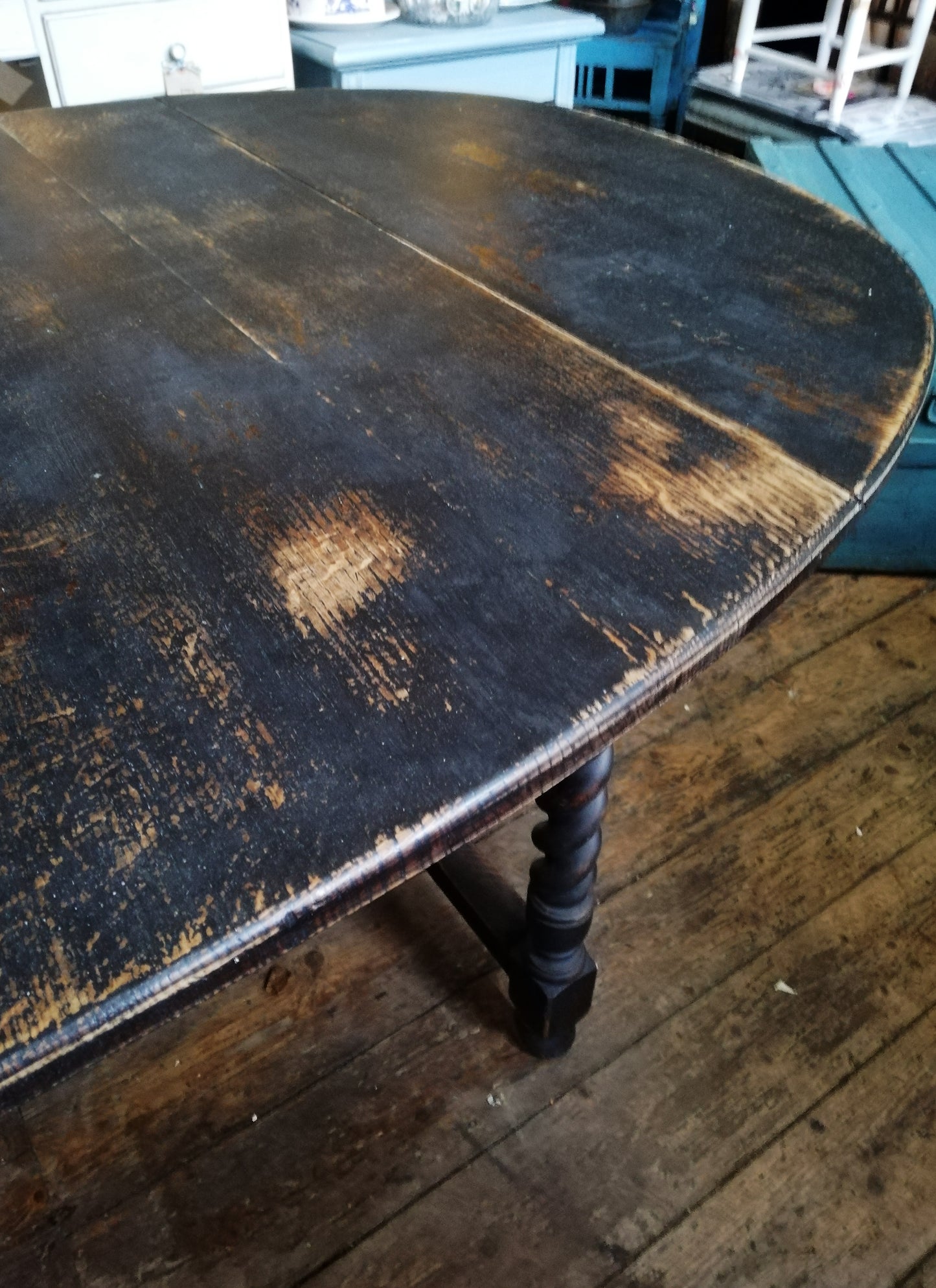 Oval dropleaf barley twist dining table painted in Miss Mustard Seed Milk Paint Typewriter black