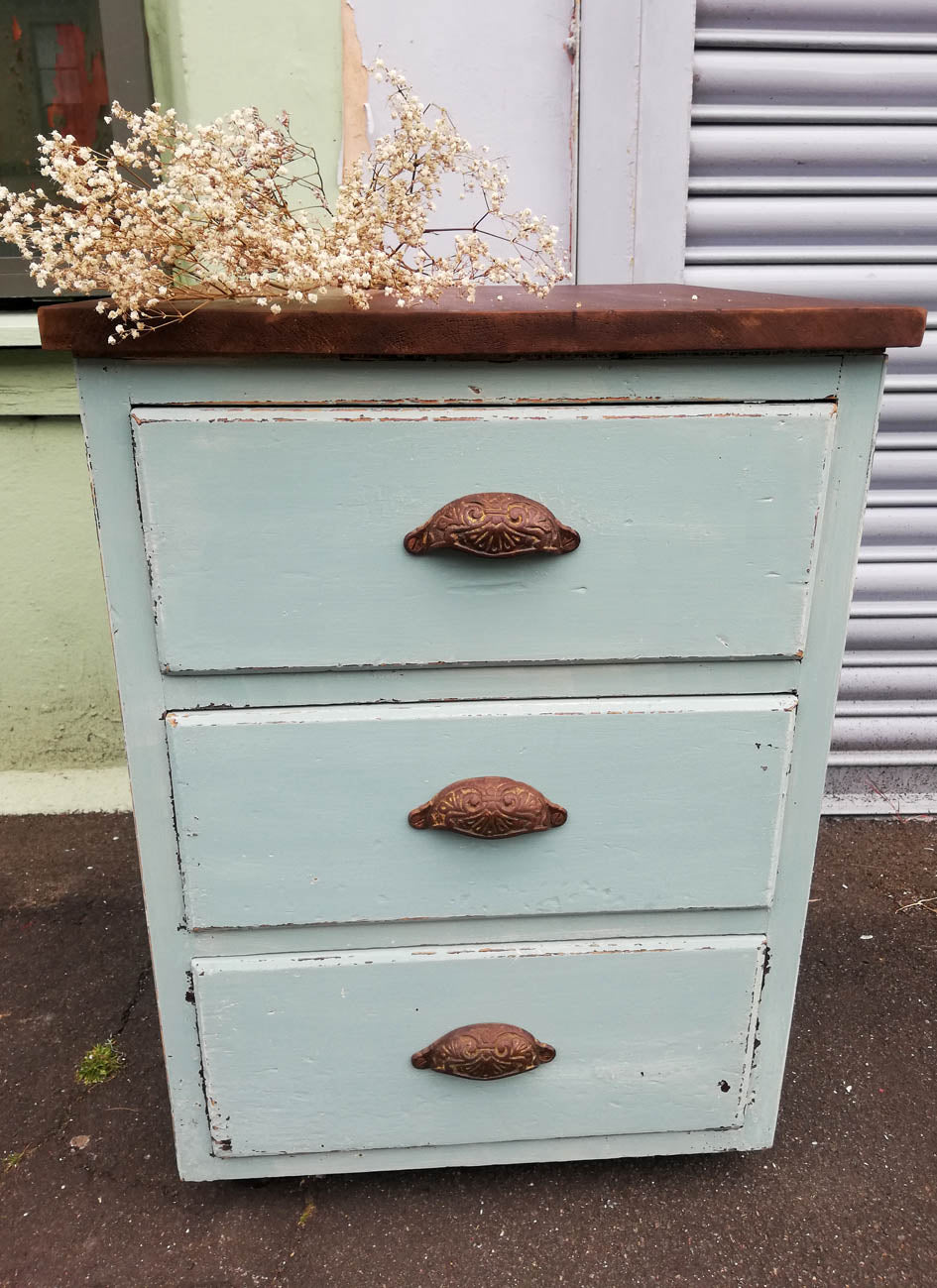 Rustic industrial set of drawers painted in a soft duck egg blue