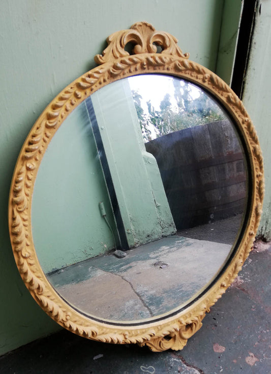 Beautiful painted vintage ornate mirror in soft mustard yellow