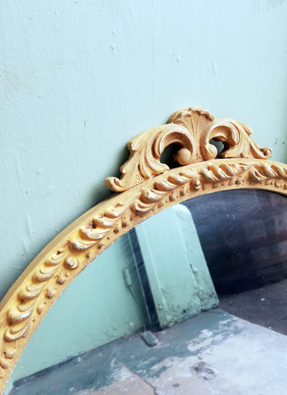 Beautiful painted vintage ornate mirror in soft mustard yellow